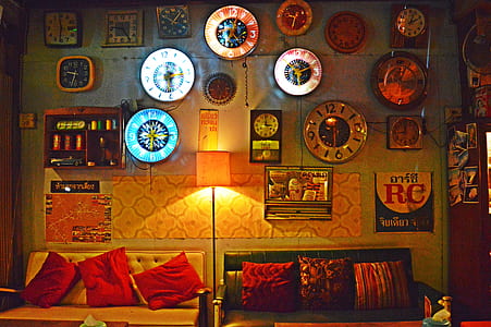 two vacant leather sofa in the room under wall clock lot thumbnail