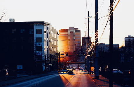 asphalt road surrounded by concrete structures thumbnail