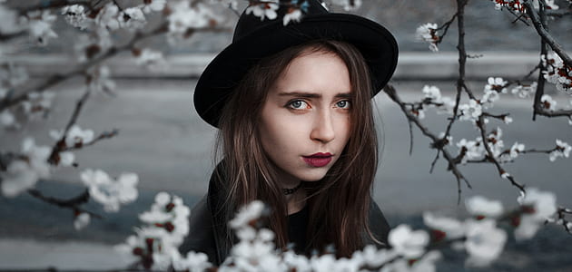 selective focus photography of woman wearing hat thumbnail
