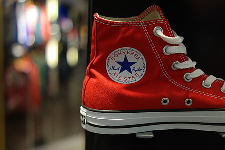 unpaired red Converse high-top shoes thumbnail