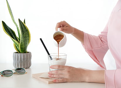 Woman Pouring Honey on Desert thumbnail