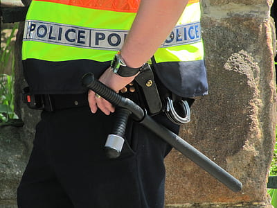 man holding black tonfa outdoor thumbnail