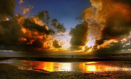 body of water under cloudy sky thumbnail