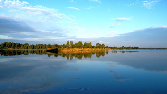 brown landscape near a body of water thumbnail