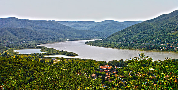 body of water beside mountains thumbnail