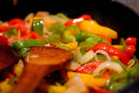 wooden spatula on cooked vegetable on skillet thumbnail