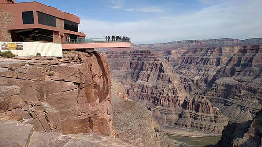 orange concrete building near rock formations at daytime thumbnail