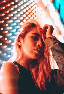 woman holding her hair thumbnail