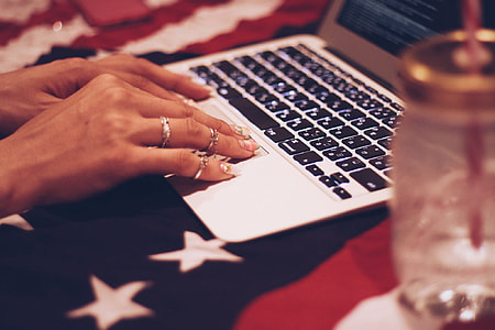 person finger touching laptop thumbnail