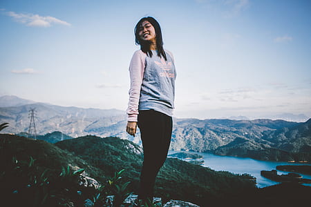 woman standing on cliff thumbnail