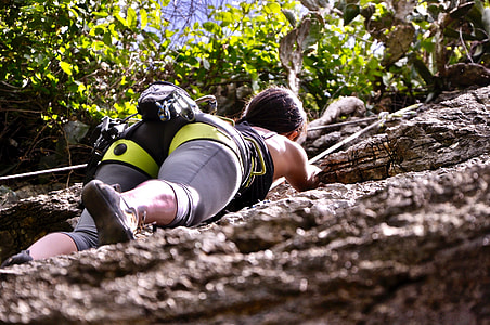 woman taking hike on brown mountain thumbnail