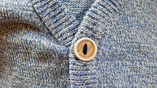 buttoned blue fabric apparel closeup photro thumbnail
