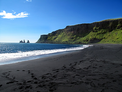 rock formation near sea under clear sky during daytime thumbnail