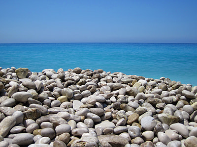 stack of gray stones near wide ocean at daytime thumbnail