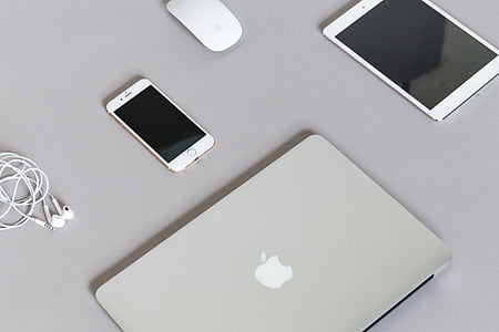 four Apple brad products on gray surface thumbnail
