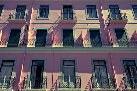 Wide-angle shot of a pink-coloured building in Lisbon, Portugal thumbnail