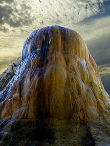 low angle photo of brown stone hill at daytime thumbnail