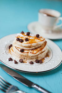 plate of pancake on teal surface thumbnail