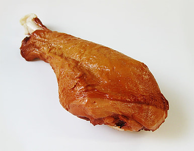 roasted chicken drumstick on white surface thumbnail