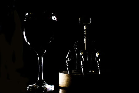 wine glass and wine stoppers on black background thumbnail