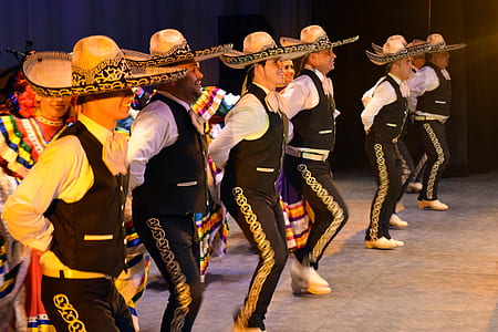 group of men wearing hat dancing thumbnail