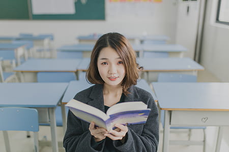 woman standing near blue tables thumbnail