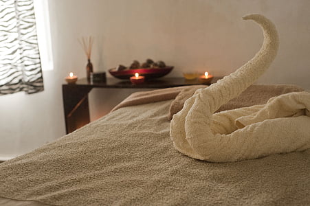 white swan bath towel on bed thumbnail