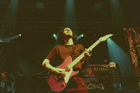 man holding electric guitar in stage thumbnail