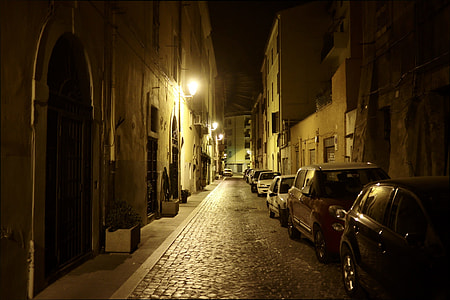 cars parked beside building thumbnail