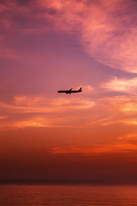 silhouette photo of flying airplane thumbnail