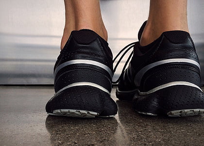 person standing on gray concrete floor thumbnail