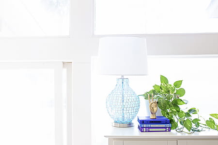 White Table Lamp on Sideboard Near Plant and Books thumbnail