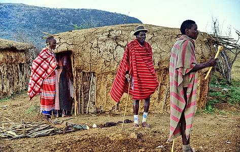 three men standing on mountain during daytime thumbnail