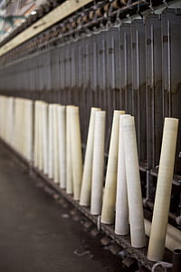 white plastic tubes on metal rack thumbnail