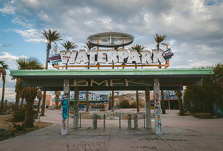 Waterpark signage under white and blue sky thumbnail