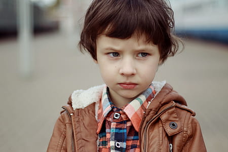 boy in brown jacket thumbnail