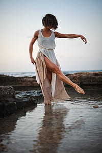 Woman Wearing White Tank Dress Posing in Body of Water thumbnail