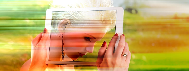 person holding white iPad timelapse photography thumbnail