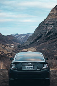 black Scion car on mountain during daytime thumbnail