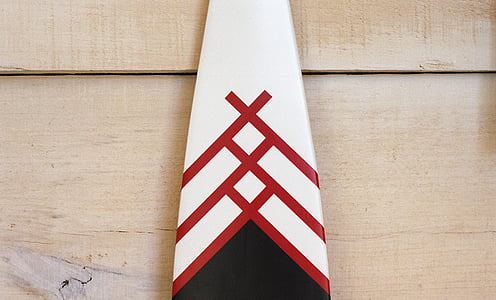 white and red board on brown wooden surface thumbnail