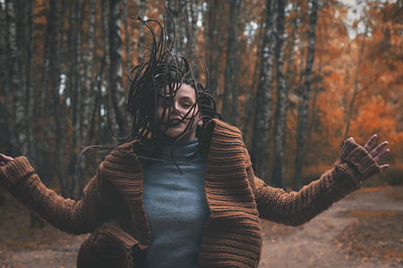 woman wearing brown sweater thumbnail