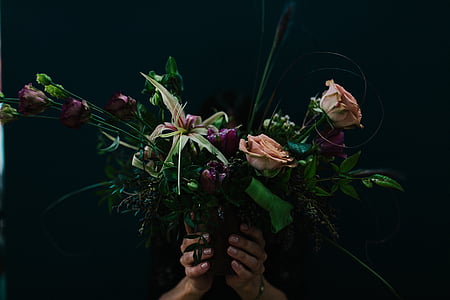 person holding bouquet of flowers thumbnail