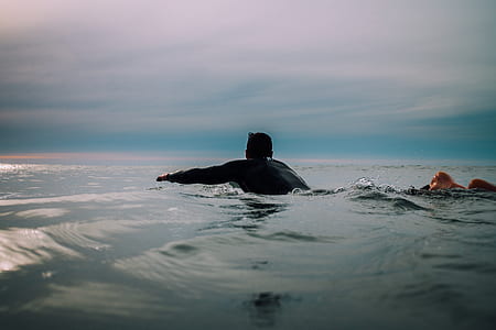 man swim in the middle of body water thumbnail