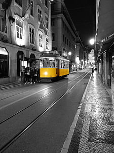 selective color photograph yellow and white tram thumbnail