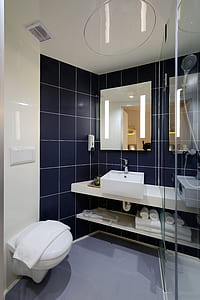 white toilet bowl near wash basin thumbnail