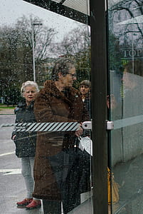 man opening glass door thumbnail