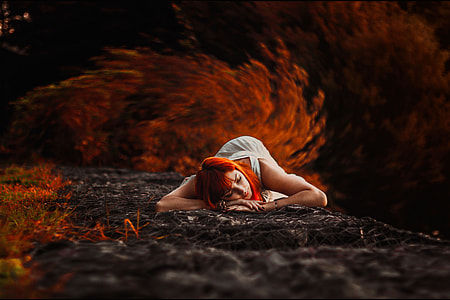 A woman lying down in the Autumn thumbnail