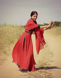 woman dancing on gray sand road thumbnail