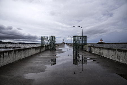 Walk to the Light House in Duluth, Minnesota under cloudy skies thumbnail