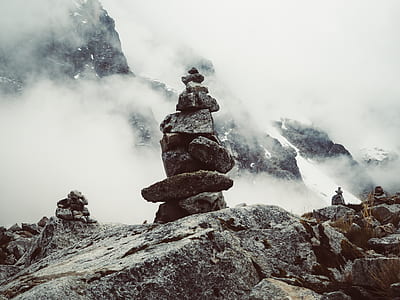 brown stack stone cairn with steams on cliff thumbnail